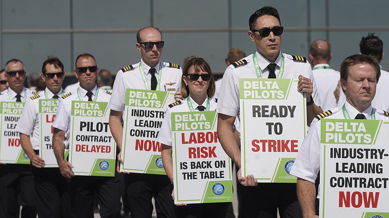 Off-duty Delta Air Lines pilots picket at Salt Lake City International Airport Thursday, June 30, 2022, in Salt Lake City.  Airlines that have stumbled badly over the last two holidays face their biggest test yet of whether they can handle big crowds when July Fourth travelers mob the nation's airports this weekend.
Problems were popping up well before the weekend, with some disruptions caused by thunderstorms that slowed air traffic. (AP Photo/Rick Bowmer)