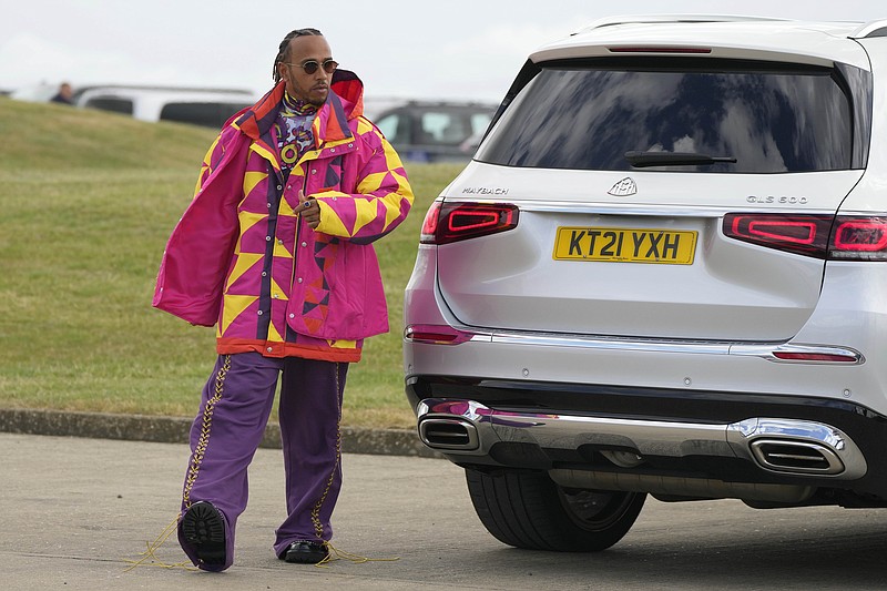 Mercedes driver Lewis Hamilton of Britain arrives at the Silverstone race track in Silverstone Thursday. The British F1 Grand Prix will be held on Sunday. - Photo by Frank Augstein of The Associated Press