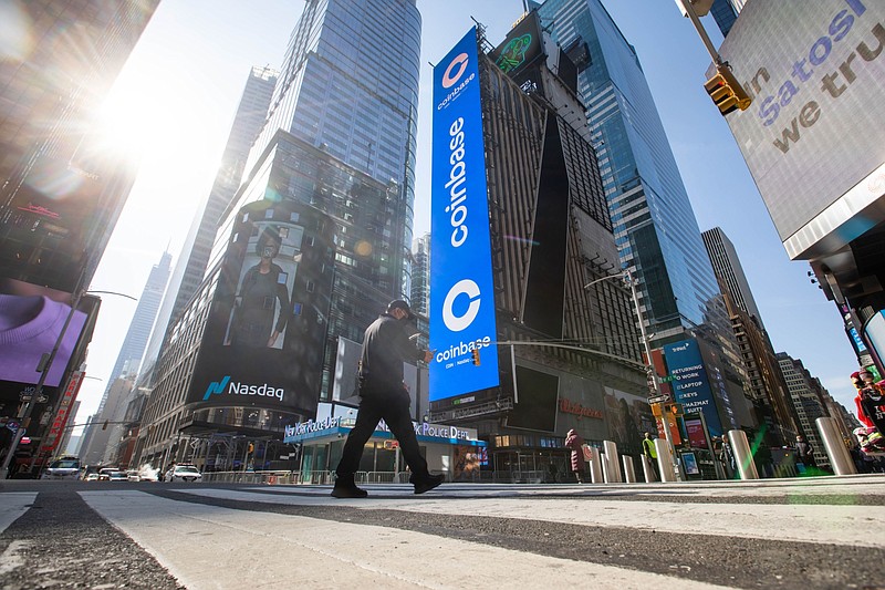 Monitors display Coinbase signage during the company's initial public offering (IPO) at the Nasdaq MarketSite in New York, on April 14, 2021. MUST CREDIT: Bloomberg photo by Michael Nagle