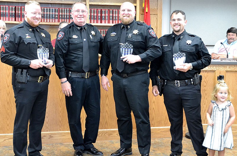 TIMES photograph by Annette Beard
Police officers Justin Lawson, Rich Fordham and Andrew Day were honored by Pea Ridge Police Chief Lynn Hahn for saving a life.