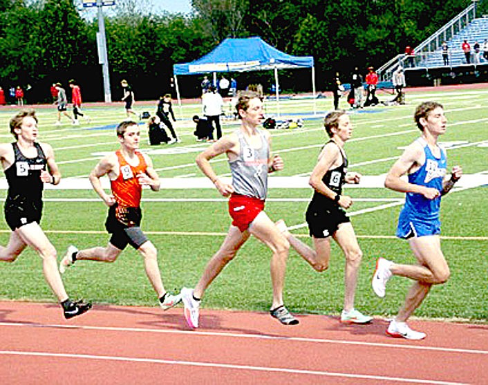 Submitted photo/Farmington 2022 graduate Micah Grusing (center) never gave up when one of his shoes came off after inadvertently getting spiked by another runner during the Class 4A State track and field 3200 meter finals on May 3, 2022, at Harrison. Grusing finished in seventh place with a time of 10:20.45.