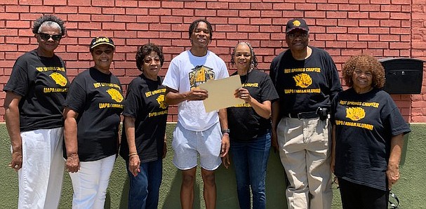 Lakeside graduate Jamison Craig, center, is awarded a $1,000 scholarship from the University of Arkansas at Pine Bluff/AMandN Hot Springs Alumni Association. Craig was joined by, from left, Deloris Massey, Virginia Taylor, Mae Robinson, Lynn Slaughter, Elijah Harris and President Willye Cooper-Martin. - Submitted photo