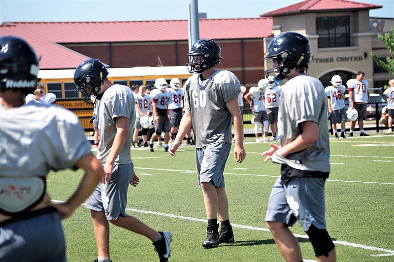 Charleston's Ben Thompson (60) is a key player for the Tigers this season. Thompson battled back from low grades as a freshman to become a team leader for the Tigers heading into his senior season. The linebacker has raised his GPA from 1.7 as a freshman to 3.2 heading into his senior year.
Special to the NWA Democrat-Gazette/Leland Barclay