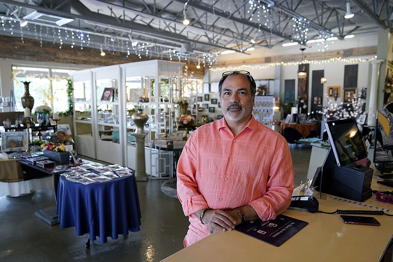 AP
Martin Garcia, owner of gift and décor store Gramercy Gift Gallery, poses for a photo at his shop In San Antonio. Landlords were forgiving about rent during the first two years of the pandemic, but now many are asking for back due rent. Meanwhile, most of the government aid programs that helped small businesses get through the pandemic have ended.