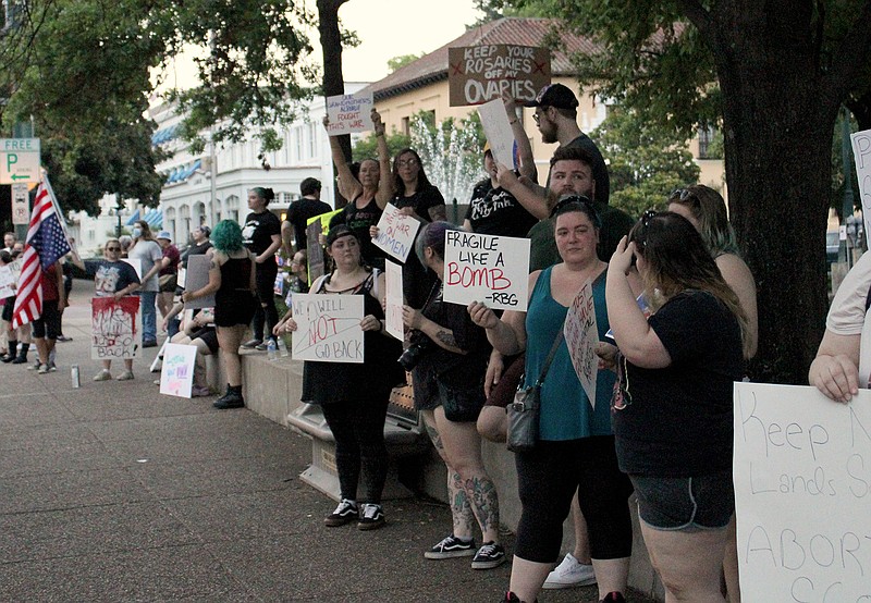 A group of protesters gathers at Hill-Wheatley Plaza Sunday evening to protest for abortion rights. - Photo by James Leigh of The Sentinel-Record