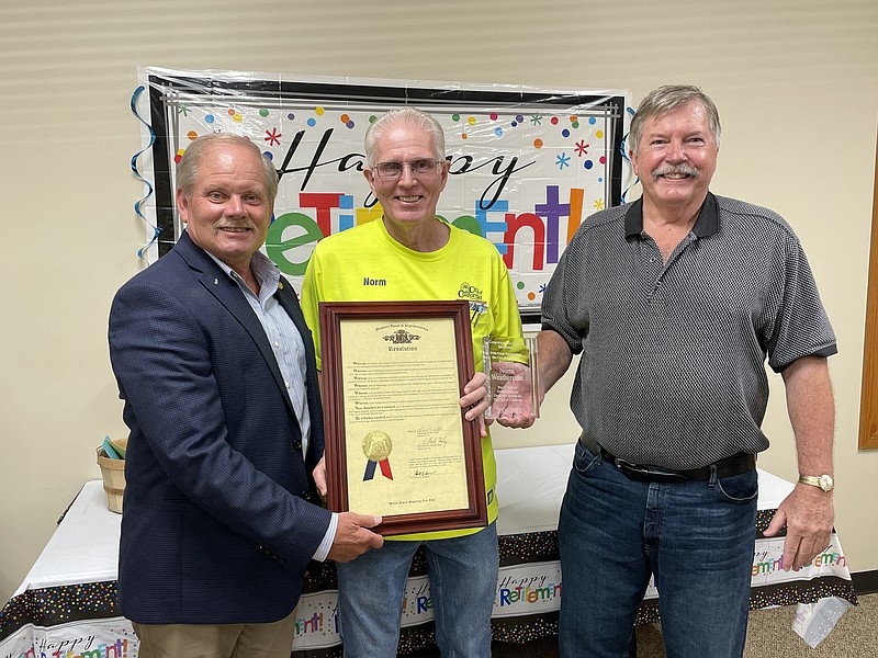 Rep. Willard Haley (left) presents a resolution to (center) City Hall building maintenance and groundskeeper Norm Weatherman. (Right) Mayor Rich Green holds Weatherman's award for 17 years of outstanding and dedicated service for the City of California. (Democrat photo/Kaden Quinn photo)