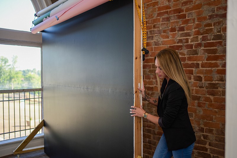 Molly Kendrick, owner of Golden Hour photography studio in downtown Texarkana, Texas, explains what elements led to her successfully starting her own business, Tuesday, July 5, 2022. (Staff photo by Erin DeBlanc)