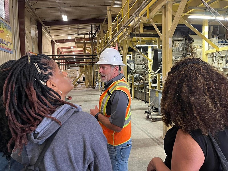 Jeff Vanderpool, chief executive officer of Highland Pellets, leads teachers on a tour during Industry Day, a program of the Economic Development Alliance for Jefferson County and Arkansas Economics. (Special to The Commercial)