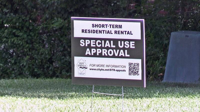 In July, a sign in front of a home in the Trivista area notifies the neighborhood the owner has applied for a short-term rental business license. - File photo by Lance Porter of The Sentinel-Record