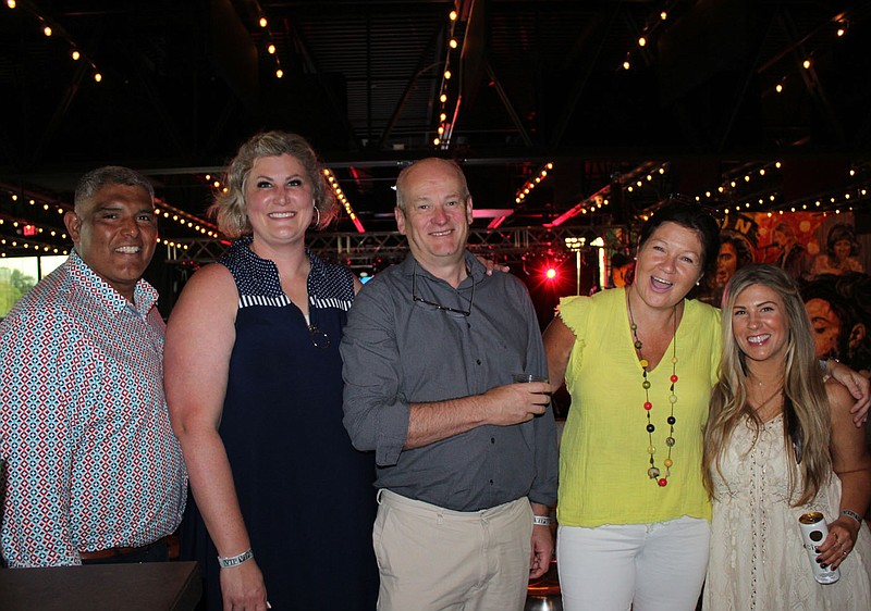 Omar and Sarah Lowrance (from left), John and Brenda O'Neill and Roni Lowrie stand for a photo at Paint the Town Red: Paintfest on June 17 at JJ's Live in Fayetteville.
(NWA Democrat-Gazette/Carin Schoppmeyer)