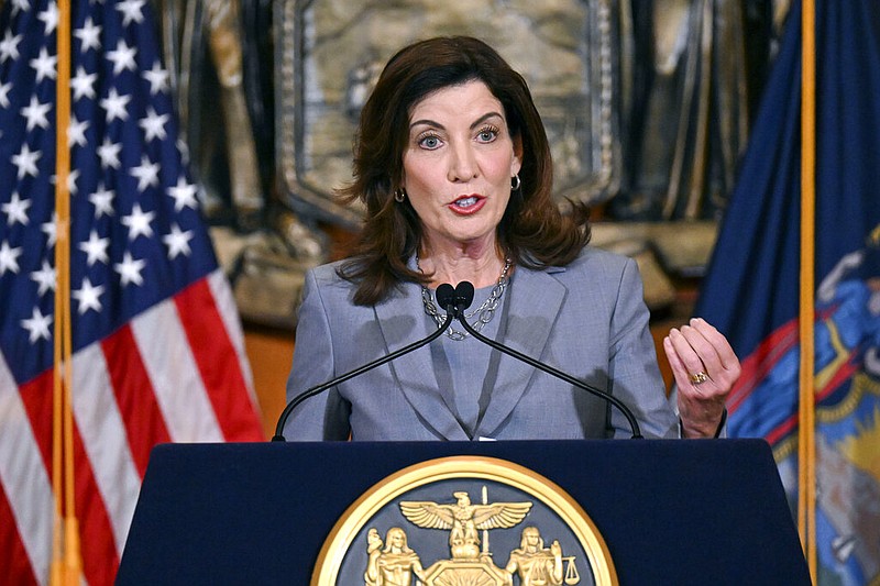 FILE - New York Gov. Kathy Hochul speaks to reporters about legislation passed during a special legislative session, in the Red Room at the state Capitol, July 1, 2022, in Albany, N.Y. New York state is rolling out a novel strategy to screen applicants for gun permits by requiring people seeking to carry concealed handguns to hand over their social media accounts for a review of their &quot;character and conduct.&quot; (AP Photo/Hans Pennink, File)