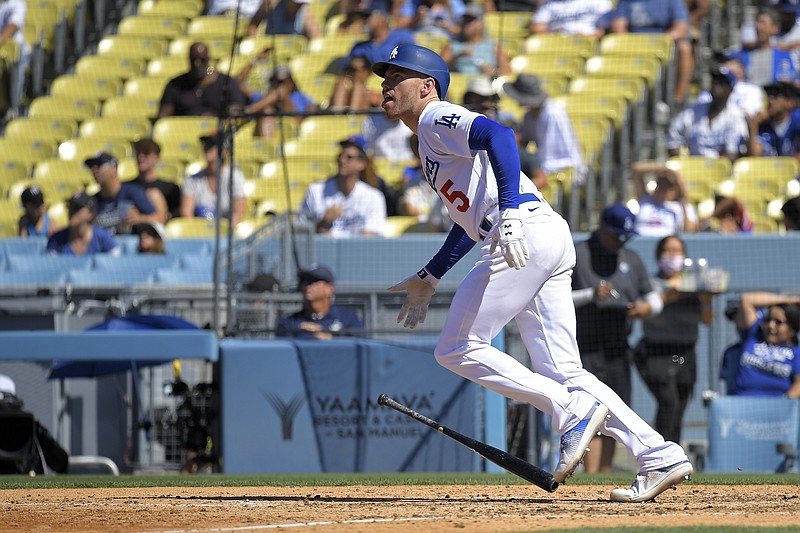 Los Angeles Dodgers' Freddie Freeman drops his bat as he hits a solo home run during the sixth inning of a baseball game against the Chicago Cubs Sunday, July 10, 2022, in Los Angeles. (AP Photo/Mark J. Terrill)