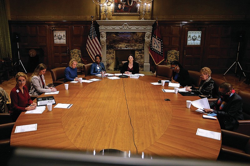 Members of the Arkansas Women's Commission listen to members, who were joining virtually, introduce themselves during the commission's first meeting on Tuesday, Feb. 22, 2022, at the state Capitol in Little Rock. One of the commission's statewide meetings will be held in Pine Bluff on Friday. (Arkansas Democrat-Gazette file photo/Thomas Metthe)