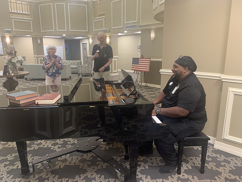 David Moore plays an Elvis Presley song for residents at Cornerstone Retirement Community. Moore works in the maintenance department but started his association with Cornerstone as a volunteer piano player. He still entertains residents every chance he gets. (staff photo by Lori Dunn)