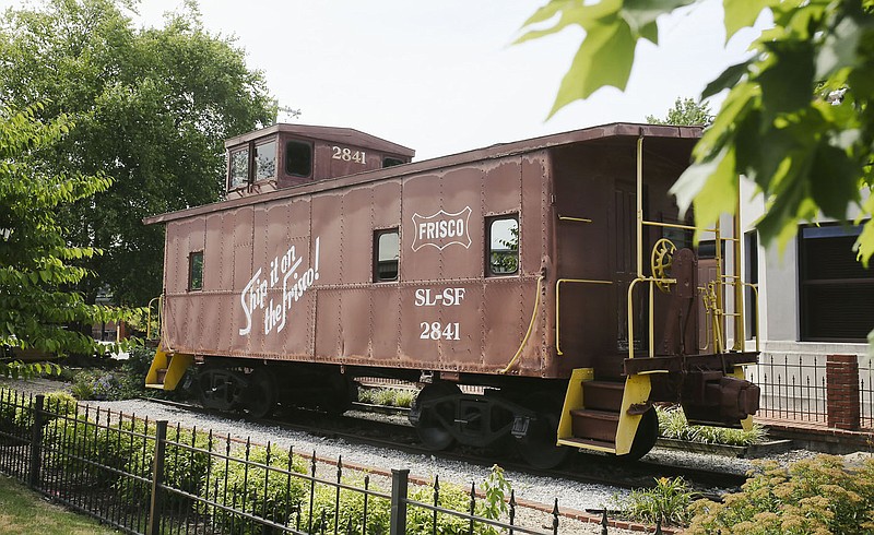 A historic train caboose is parked, Thursday, July 7, 2022 at the historic train depot in Bentonville. The search is on to find the first director of the Bentonville History Museum. A soft opening is planned for Sept. 1. A search committee met Thursday afternoon to winnow down applications. Visit nwaonline.com/220708Daily/ for today's photo gallery.

(NWA Democrat-Gazette/Charlie Kaijo)