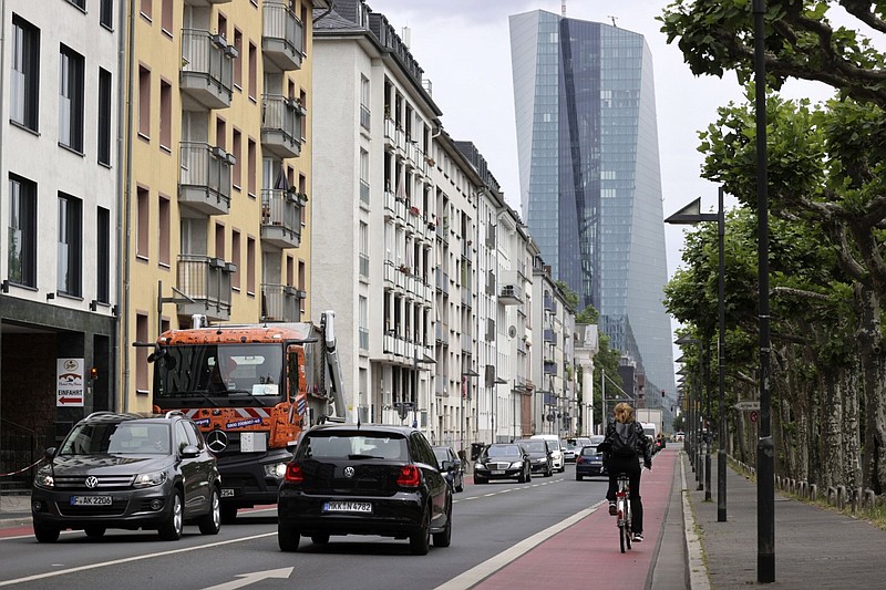The European Central Bank (ECB) headquarters beyond traffic passing residential buildings in Frankfurt, Germany, on Monday, May 23, 2022. MUST CREDIT: Bloomberg photo by Alex Kraus