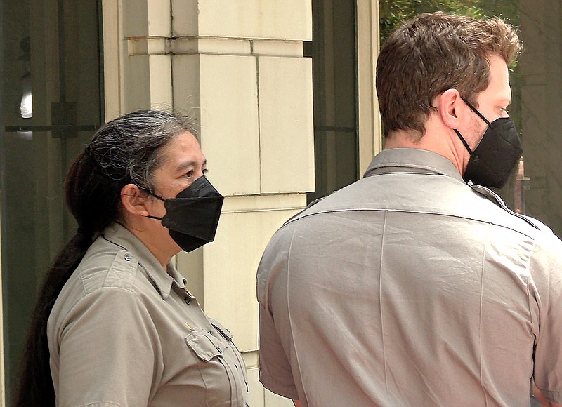 Hot Springs National Park Guide Lissa Allen and HSNP Ranger Daniel Schmill wear masks at the Fordyce Bath House Friday. The national park reinstated its mask mandate for employees and the public due to the increased rate of transmission in Garland County. - Photo by Lance Porter of The Sentinel-Record