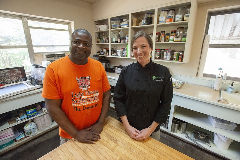 Nate Walls founder of Secondhand Smoke (left) and Rebecca Liles, VP and Chief Operating Officer for Mount Sequoyah in the kitchen at Mount Sequoyah Monday July 25, 2022.  (NWA Democrat-Gazette/J.T. Wampler)