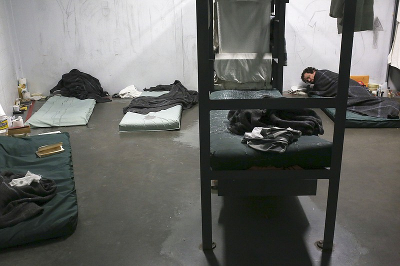 Bed mats are laid out next to a bunk bed in an overflow bunking area, Monday, January 10, 2022 at the Washington County Detention Center in Fayetteville. (NWA Democrat-Gazette/Charlie Kaijo)