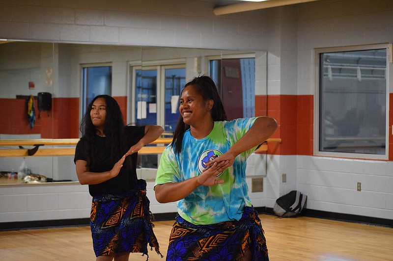 Miriam Pedro (left) rehearses a dance with her teacher Arlynda Jonas (right) that she’ll perform at Stroll the Atolls July 30.

(Special to NWA Democrat-Gazette/Antoinette Grajeda)