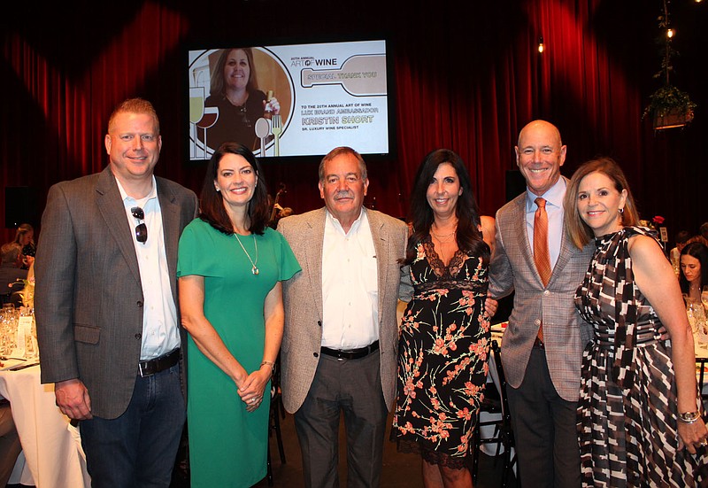 John and Diana Marshall (from left), Mark Henneberger, Gina Rollins and Peter Lane and Barb Putman welcome guests to the Winemaker's Dinnner on July 19 at the Walton Arts Center in Fayetteville.
(NWA Democrat-Gazette/Carin Schoppmeyer)