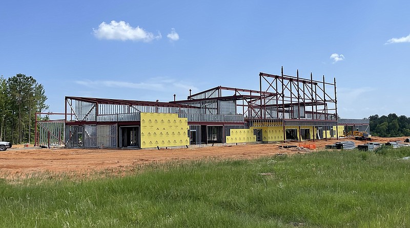 The airport is a key driver in regional interest. In this photo by airport real estate manager Tyler Brown, the first floor of the new, steel-framed passenger terminal at Texarkana Regional Airport is being enclosed with walls. Construction began in December 2021 and is on track to be complete by mid-2024. Masonry work will start later this year. The building will include two jet bridges, and the new parking lot will accommodate up to 335 cars. (Photo by Tyler Brown)