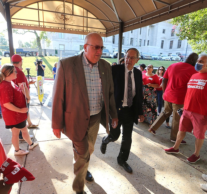 Sen. Matthew Pitsch (left) and Rep. Jack Ladyman (right) are greeted by teachers from across the state before the Arkansas Legislative Council meeting on Thursday, July 21, 2022, at the state Capitol in Little Rock. 
More photos at www.arkansasonline.com/722alc/
(Arkansas Democrat-Gazette/Thomas Metthe)