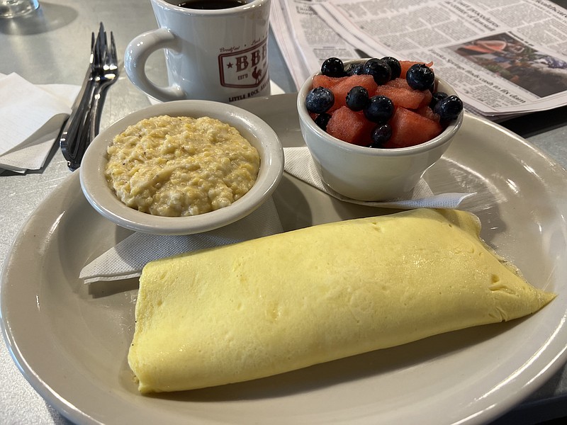A three-egg omelet wraps three cheeses and comes with two side items. (Arkansas Democrat-Gazette/Eric E. Harrison)