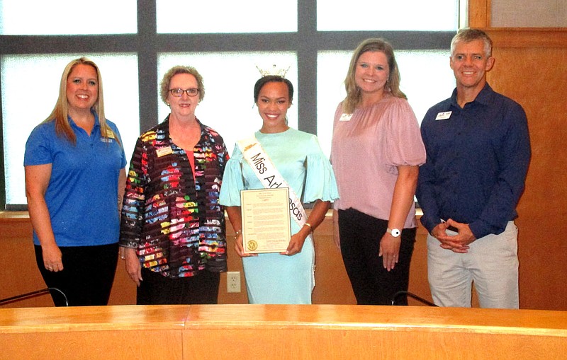 Marc Hayot/Herald-Leader Ebony Mitchell (center), the current Miss Arkansas received a proclamation from Mayor Judy Nation on Friday at city hall. Mitchell posed with (l-r) Kathryn Brown Cottrell associate director of alumni and parent engagement at John Brown University; Nation; Lindsey Taylor director of community development for the Siloam Springs Chamber of Commerce and Chamber President and CEO Arthur Hulbert.