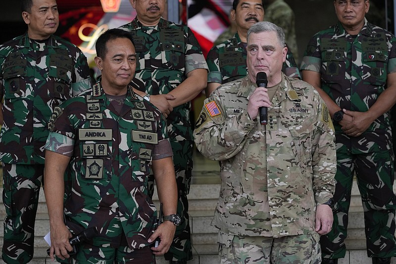 U.S. Chairman of the Joint Chiefs of Staff Gen. Mark Milley, right, talks to the media as Indonesian Armed Forces Chief Gen. Andika Perkasa, left, listens, after their meeting at Indonesian military headquarters in Jakarta, Indonesia, Sunday, July 24, 2022. The Chinese military has become significantly more aggressive and dangerous over the past five years, the top U.S. military officer said during a trip to the Indo-Pacific that included a stop Sunday in Indonesia. (AP Photo/Achmad Ibrahim)