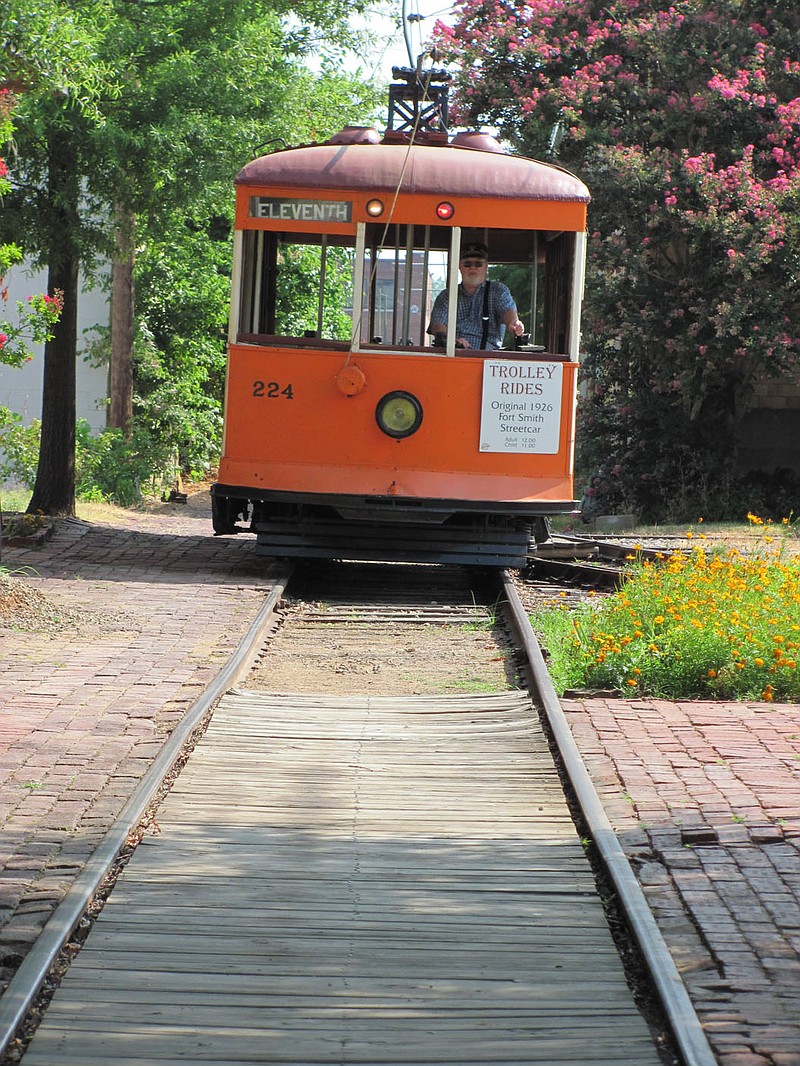 The restored trolley No. 224 that once rode the rails in Fort Smith in the early 20th Century trundles down the tracks toward the trolley station near the Fort Smith Trolley Museum.Arkansas Democrat-Gazette/DAVE HUGHES
