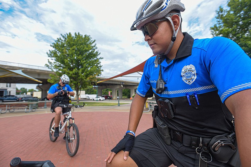 Manuel Valente-Sotelo (right) and Alejandro Marin with the Fort Smith Police Departmentâ€™s Bicycle Patrol Unit ride on Thursday, July 28, 2022, in downtown Fort Smith. After years of being defunct, the bike unit started patrolling again on July 15. Visit nwaonline.com/220731Daily/ for today's photo gallery.
(NWA Democrat-Gazette/Hank Layton)
