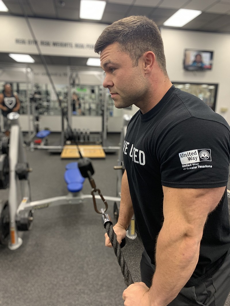 Physical trainer Matthew Lovell works out at Legends Gym on June 29, 2022, in Texarkana Texas. Lovell, who has been bodybuilding for seven years, said eating right, working out and getting enough sleep are key to muscle gain. (Staff photo by Mallory Wyatt)