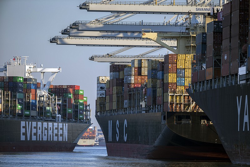 FILE - Container ship Ever Far, left, sails down river past the Georgia Ports Authority's Port of Savannah in Savannah, Ga., Wednesday, Sept. 29, 2021. The Port of Savannah saw record-breaking cargo volumes in fiscal 2022 amid a surge in imports and West Coast backlogs prompting shippers to reroute goods to the East Coast, the Georgia Ports Authority said Tuesday, July 26, 2022. (AP Photo/Stephen B. Morton, File)