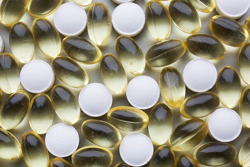 Vitamin D tablets and pills are displayed, Nov. 9, 2016, in New York. More research suggests it&#x2019;s time to abandon the craze over vitamin D. Taking high doses of &#x201c;the sunshine vitamin&#x201d; doesn't reduce the risk of broken bones in generally healthy older Americans, Harvard researchers reported Wednesday, July 27, 2022. (AP Photo/Mark Lennihan)