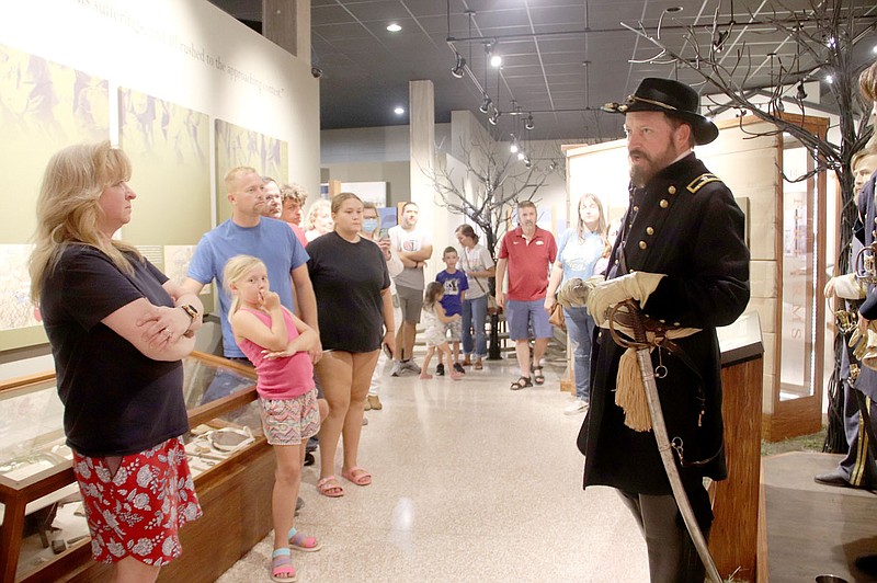 LYNN KUTTER ENTERPRISE-LEADER
Jim Spillars portrays Union Brigadier Gen. James Blunt on Sunday night for a program at Prairie Grove Battlefield State Park called Hindman Hall Museum: After Dark. About 30 visitors participated in the program to hear about the Battle of Prairie Grove from Living Historians, including Blunt, two soldiers and a civilian. Mattison Griffin, state park interpreter, said she planned the 9 p.m. event so visitors could see the museum after normal hours and hear stories they normally wouldn't hear.