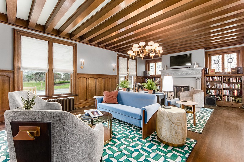 The Werner House’s living area features a coffee table that can rise to desk or dining height, patented walker holders on chair backs, high-density foam seat cushions to make getting up easier, and a zero-edge area rug to reduce tripping. (Courtesy of Columbus Pics)