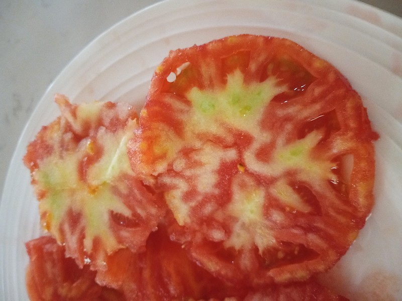 Tomatoes can develop corky innards and ripen unevenly during extremely hot weather.  
(Special to the Democrat-Gazette)