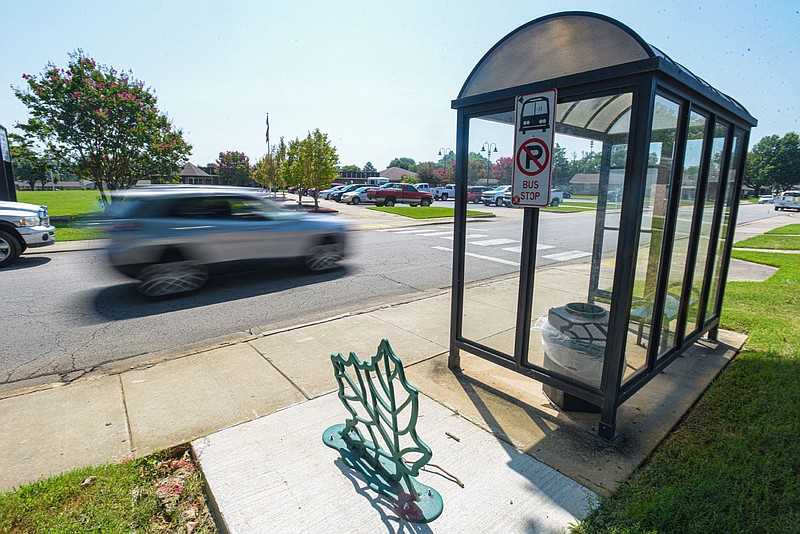 Traffic passes a bus stop on Friday, August 5, 2022, along N. 31st Street in Fort Smith. Talicia Richardson, executive director of 64.6 Downtown, said the organization has teamed up with artist Sarah Ridgley and the city of Fort Smith to produce “art-infused” transit shelters in and around the downtown area that will feature works from local artists. Ken Savage, director of the Fort Smith Transit Department, said 10 of these transit shelters are currently planned and will be paid for using a combination of federal funds and a donation from Ridgley. Visit nwaonline.com/220807Daily/ for today's photo gallery.
(NWA Democrat-Gazette/Hank Layton)