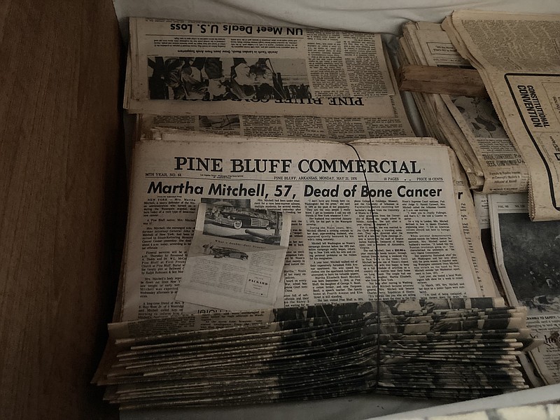 An upstairs trunk holds bundles of newspapers that carry stories of Martha Mitchell's life and times. (Pine Bluff Commercial/Byron Tate)
