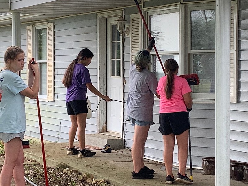 3MT volunteers clean up local homes as part of their service project for the organization. Its through their mission work they are able to spread their faith as well as help the community. (Submitted photo)