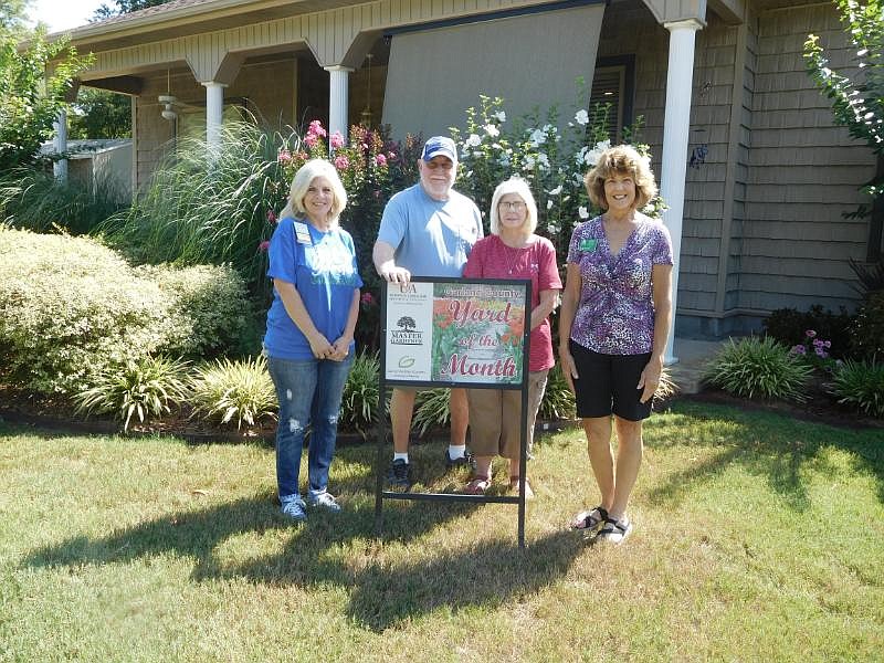 From left are Master Gardener Karin Grisham, homeowners Jerry and Ellen Spakes and Master Gardener Juneann Greene. - Submitted photo