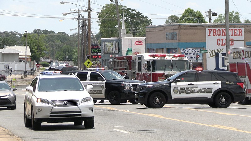 Hot Springs police work the scene where a male pedestrian was struck and killed by a passing vehicle in the 2700 block of Central Avenue shortly after 1 p.m. Tuesday. - Photo by Lance Porter of The Sentinel-Record