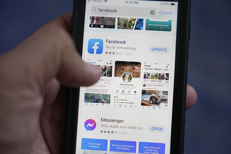 The Facebook app is shown on a smart phone, Friday, April 23, 2021, in Surfside, Fla. As you look through your social media feeds this summer, fear of missing out, or FOMO, can kick in when it seems like everyone you know is strolling through Paris or lounging on a tropical beach.    (AP Photo/Wilfredo Lee)