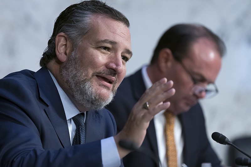 Sen. Ted Cruz, R-Texas, joined at right by Sen. Mike Lee, R-Utah, questions Justice Department officials as the Senate Judiciary Committee examines the threats toward elected leaders and election workers, at the Capitol in Washington, Wednesday, Aug. 3, 2022. (AP Photo/J. Scott Applewhite)