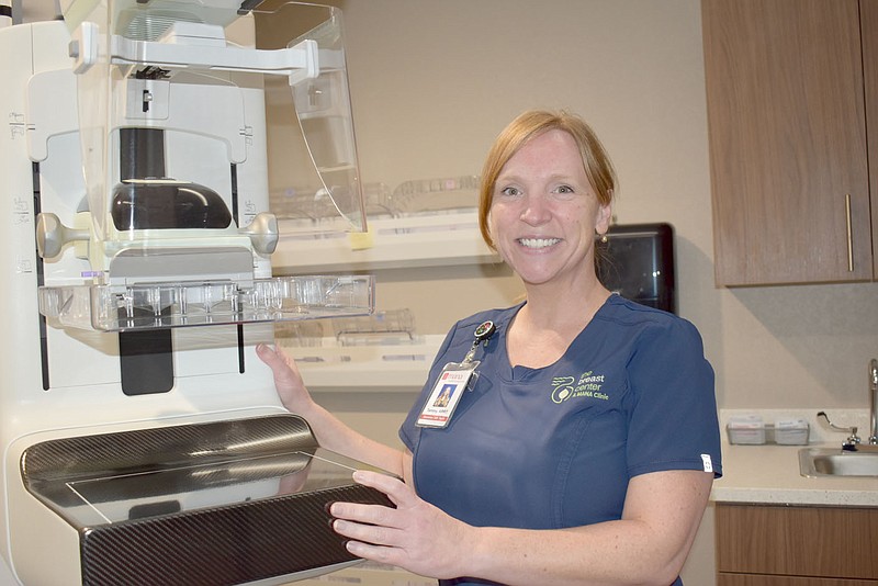 Mammographer Tammy Oakes is pictured with the machine in the exam room at the new Breast Center clinic in Bella Vista.
(NWA Democrat-Gazette/Rachel Dickerson)