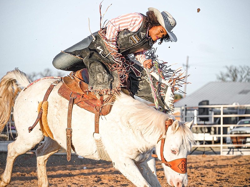 Even though her face is her franchise, Ja’Dayia Kursh still is not afraid to get down to rodeo business, riding bucking broncs in competition. (Special to the Democrat-Gazette)