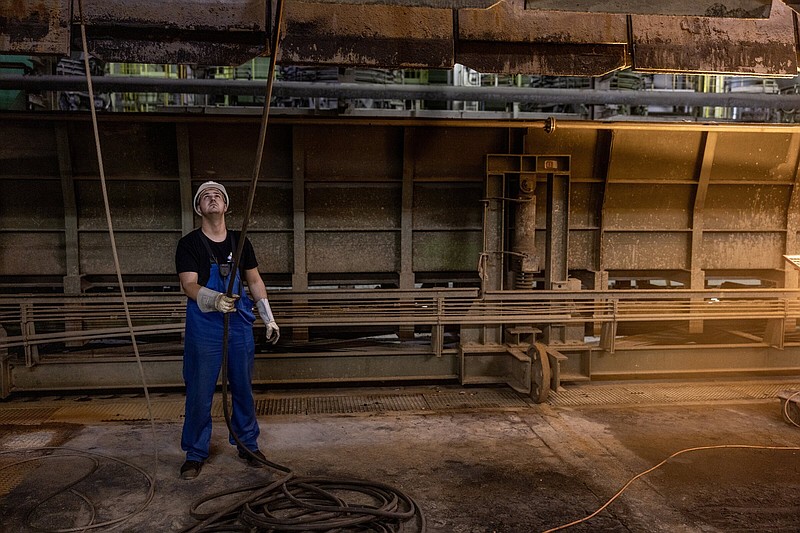 A worker conducts maintenance inside the Bexbach plant. MUST CREDIT: Photo by Daniel Etter for The Washington Post.