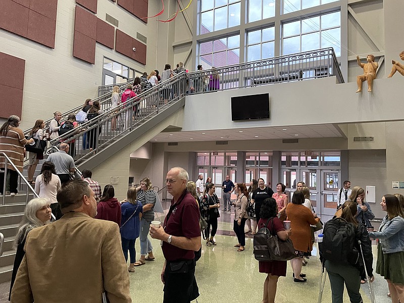 Spencer Bailey/Siloam Sunday Siloam Springs School District staff and faculty mingle and walk through the high school during the annual Back to School Breakfast event.