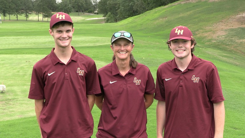 Lake Hamilton golf senior Zac Pennington, left, head coach Brandi Higginbotham and senior Ben Varner stand on a course at the Magellan Golf Club in Hot Springs Village Thursday during a match against Fountain Lake. - Photo by Lance Porter of The Sentinel-Record